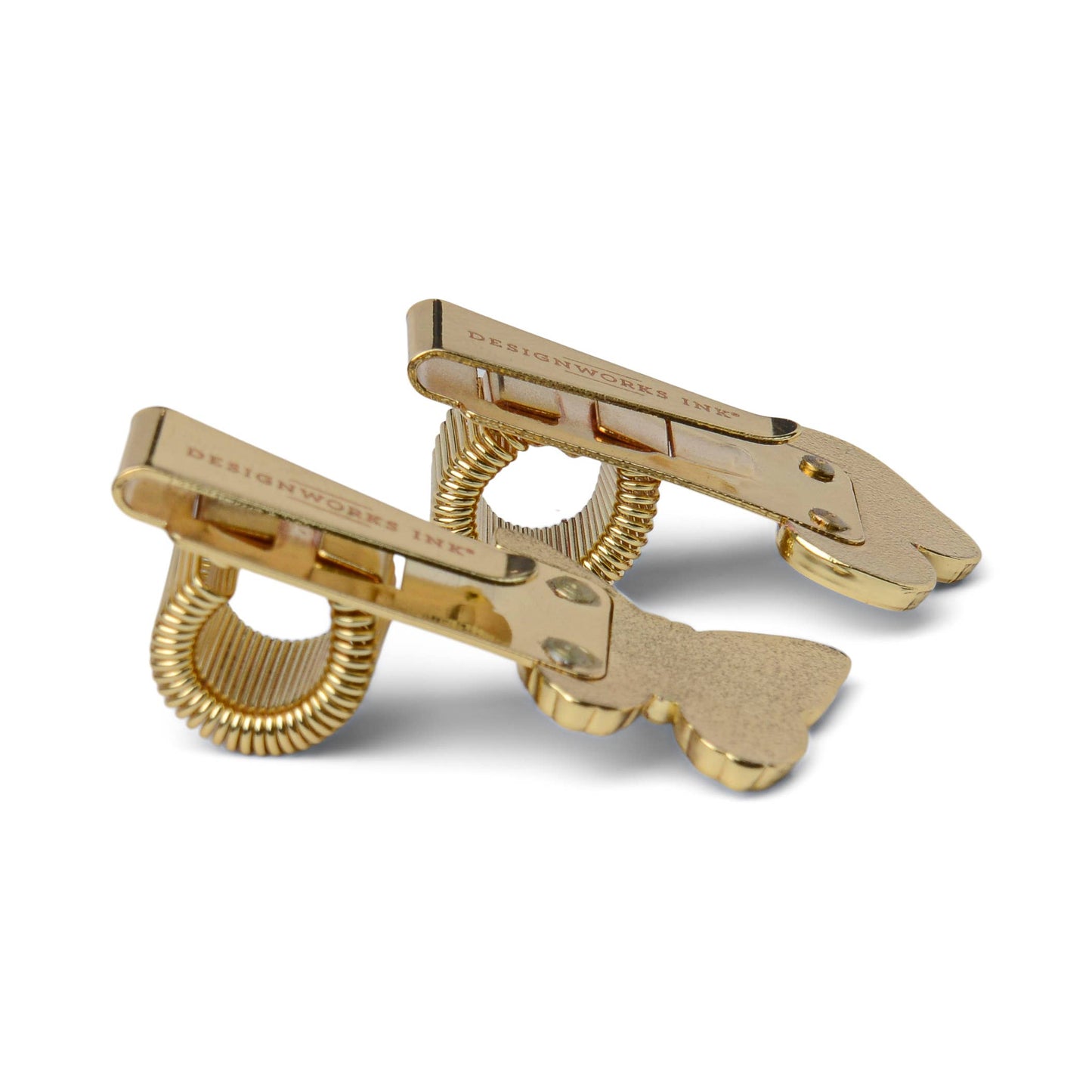 Gold-colored hair clips on a white background