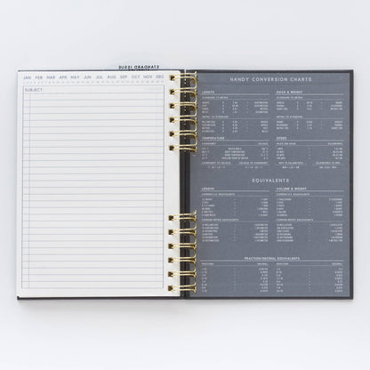 Open planner showing a daily log on one side and conversion charts on the other, on a white background.