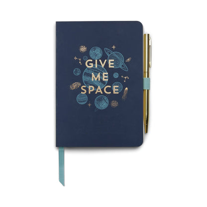Navy blue notebook with 'Give Me Space' design and pen on a white background