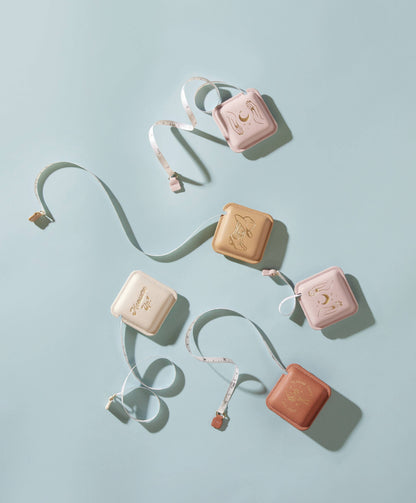 Set of small rectangular cases with straps on a light blue background