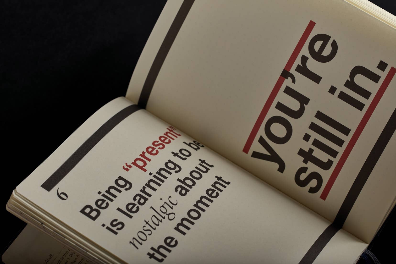 Open book with text on a black background