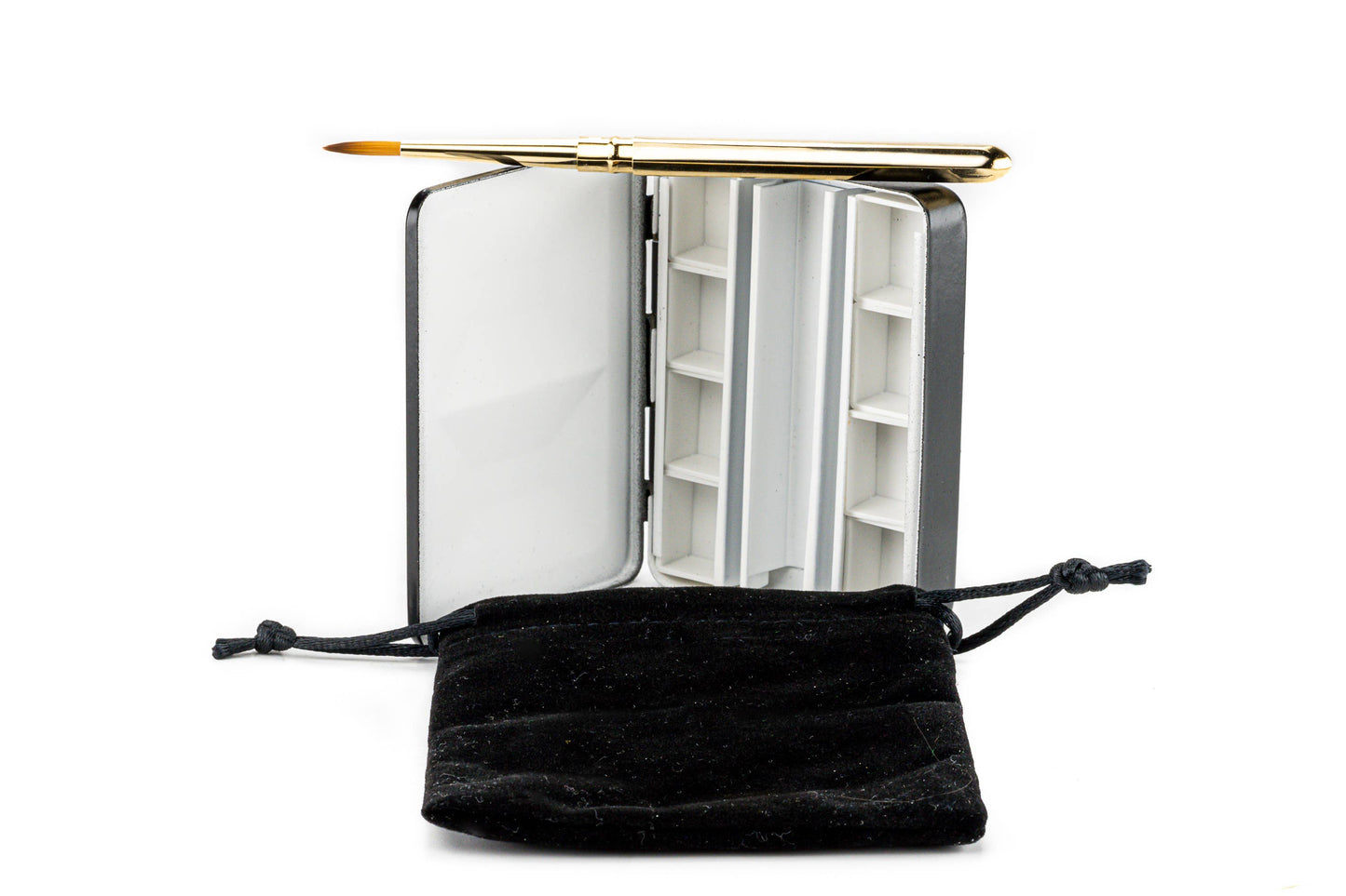 Small open book with a gold pen on a white background