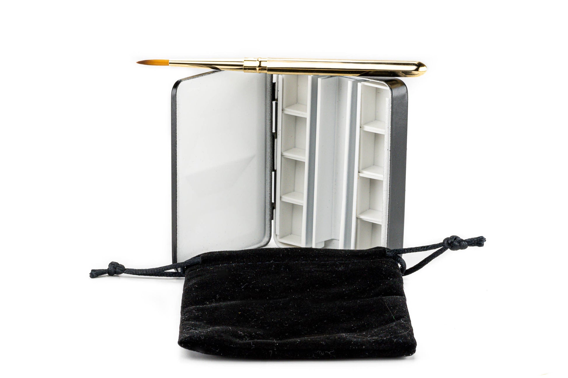 Small open book with a gold pen on a white background