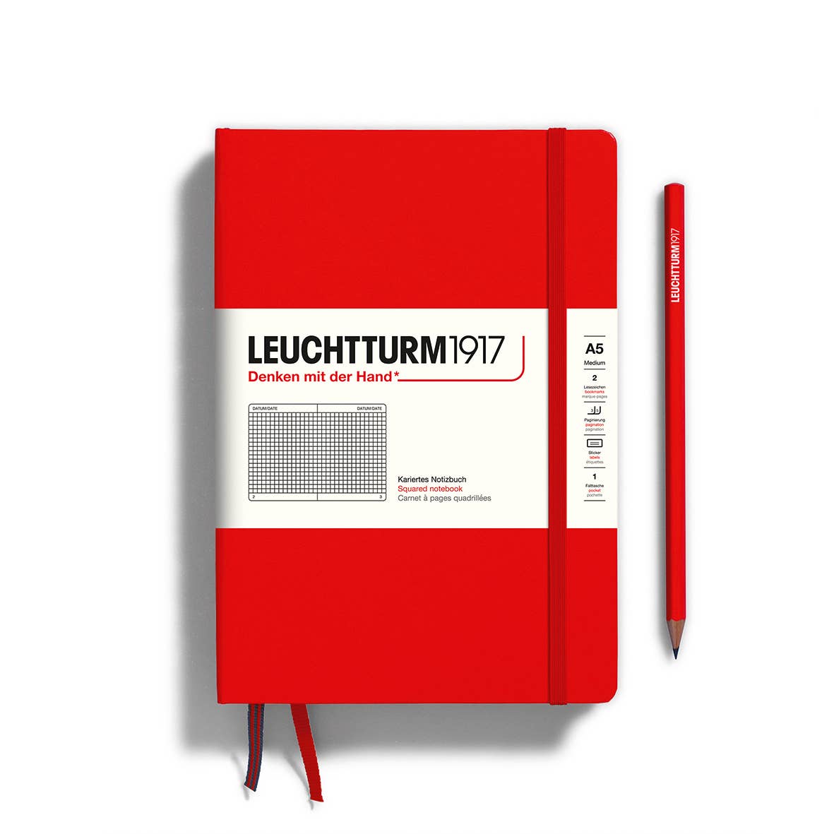 Red notebook with white cover featuring Leuchtturm1917 branding on a white background