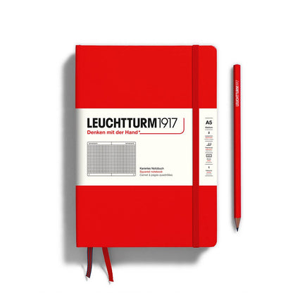 Red notebook with white cover featuring Leuchtturm1917 branding on a white background