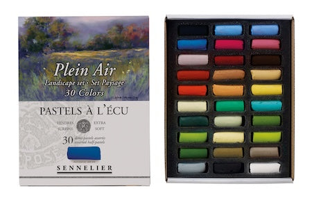 A collection of extra-soft pastel half sticks in various colors, presented in a cardboard set with the text 'Paris Collection' on the packaging.