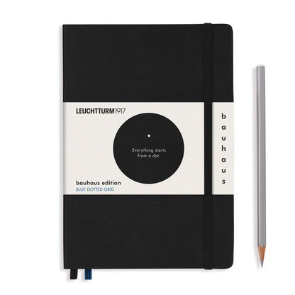 Black notebook with white label featuring Leuchtturm1917 branding and a pencil on a white background