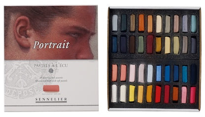 A collection of extra-soft pastel half sticks in various colors, presented in a cardboard set with the text 'Paris Collection' on the packaging.