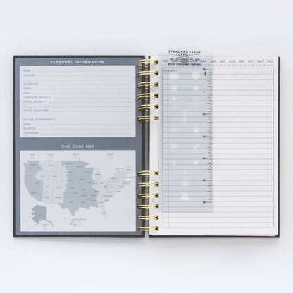 Open planner with time zone map and daily schedule on a white background
