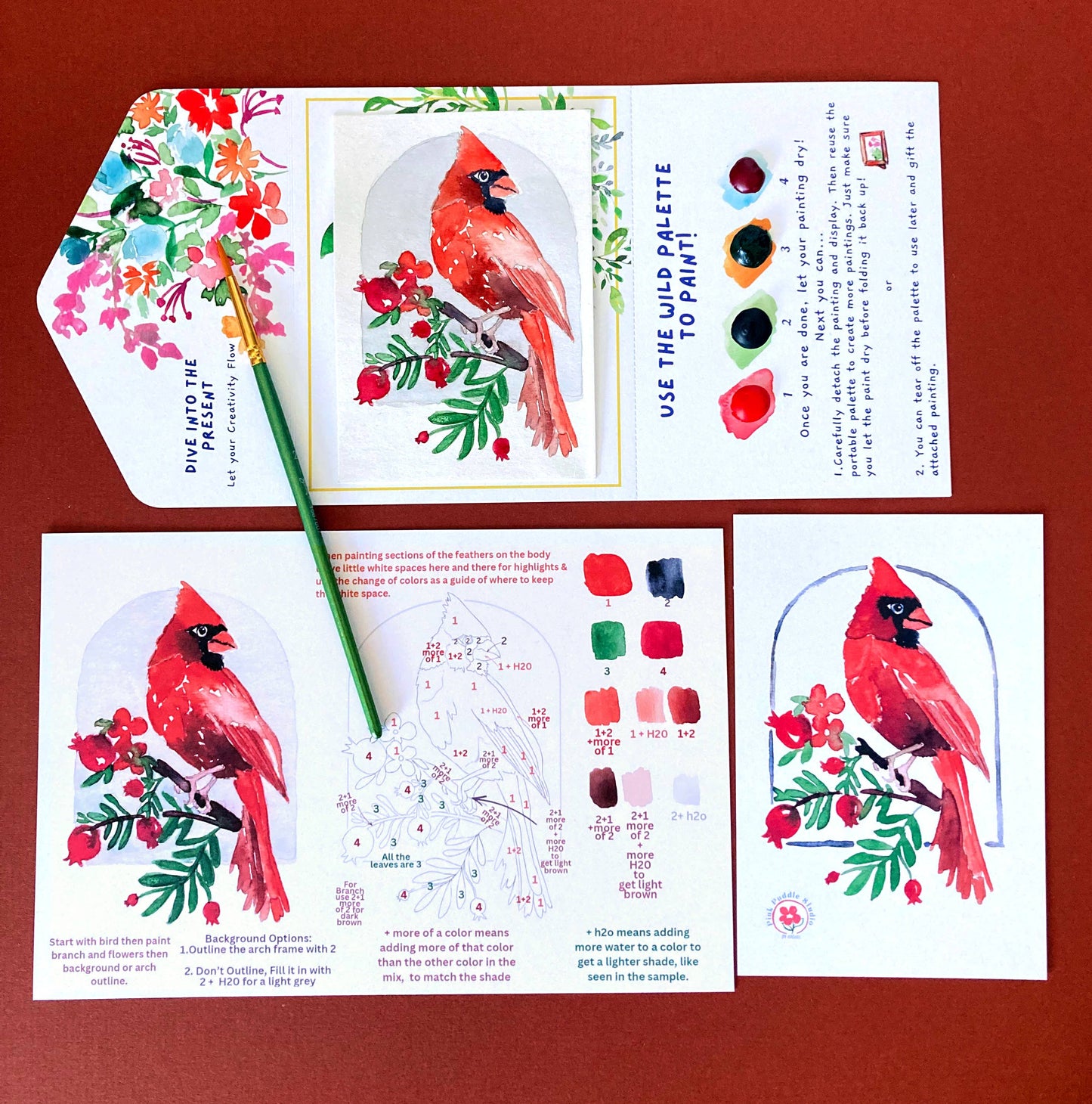 Educational art kit with cardinal illustrations and color mixing guide on a red background