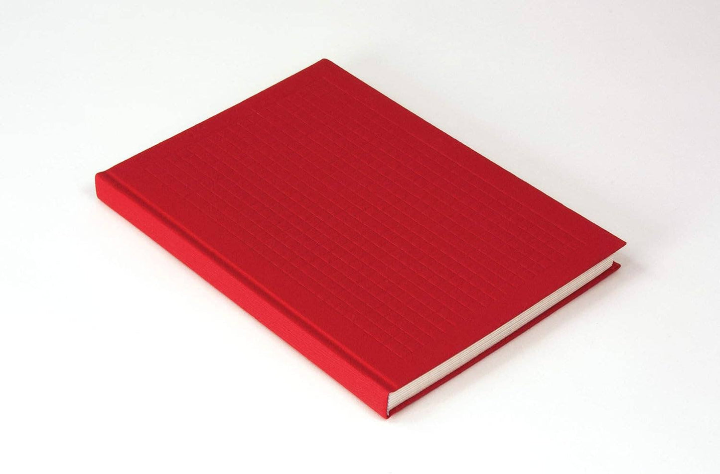 Red notebook on a white background