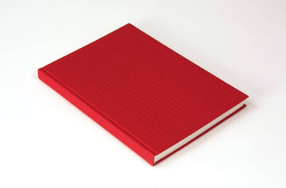Red notebook on a white background