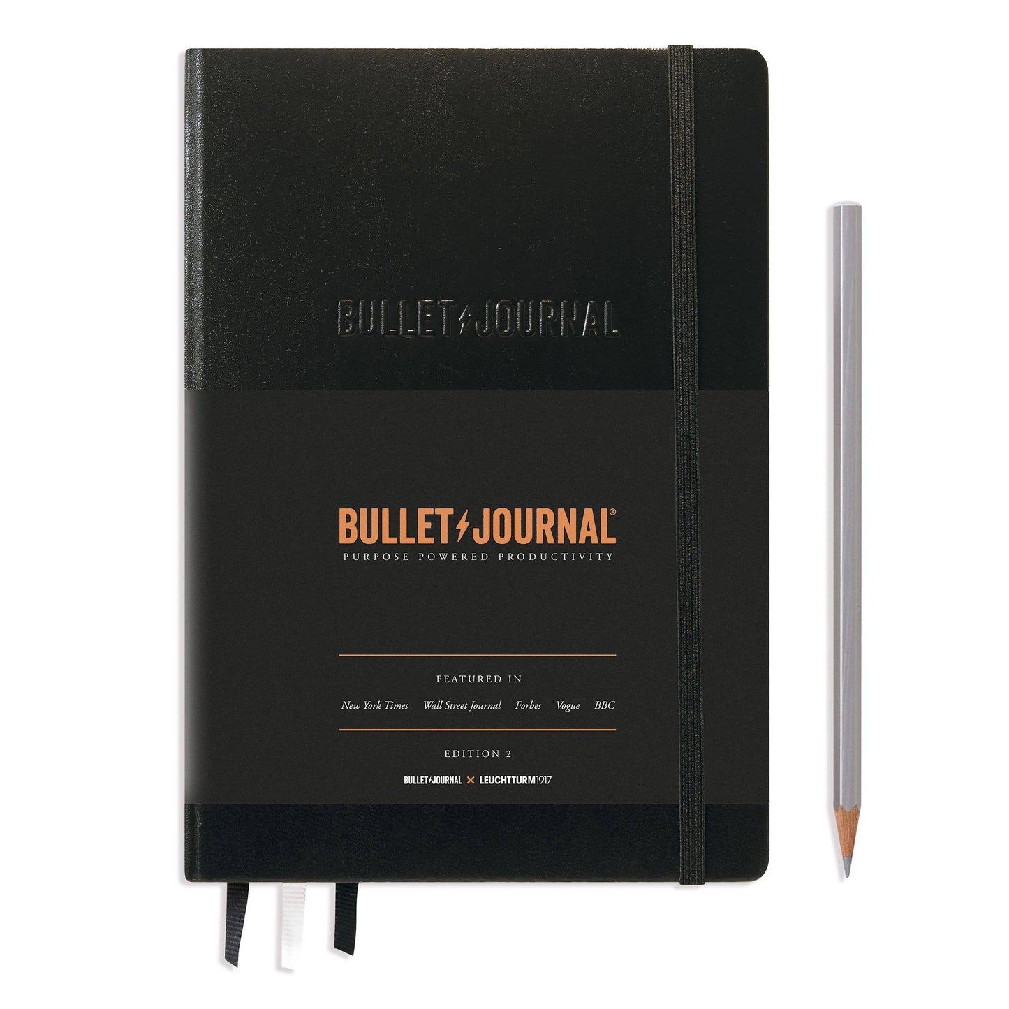 Black Bullet Journal notebook with a pencil on a white background