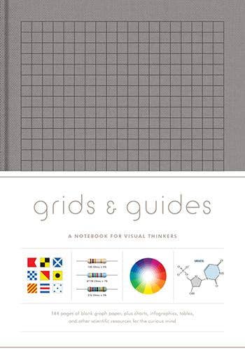 Notebook cover with grid design and text 'grids & guides' on a white background