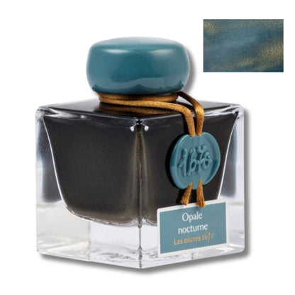 Ink bottle with teal cap and label on a white background