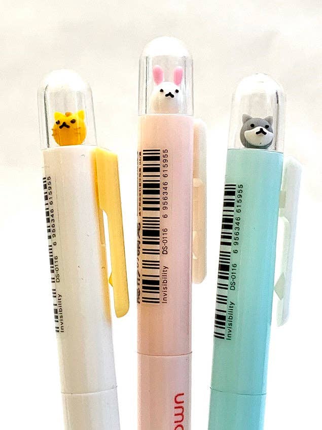 Three pens with cartoon animal ends on a white background
