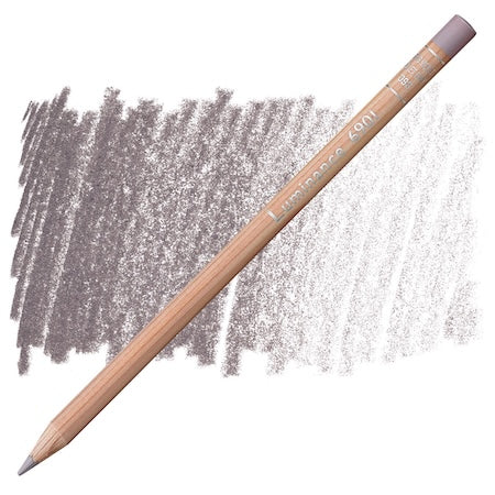 A Caran Dache Professional Luminance Pencil with a wooden body and a smudged gray color on one end, placed next to a similar gray smudge on a white background.