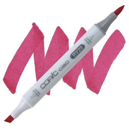 Copic Ciao marker in crimson color with a double-ended design, showing the super brush tip on the left and the medium broad tip on the right, against a pink background.
