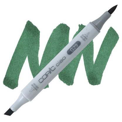 Copic Ciao marker in Pine Tree Green color with a swatch of green ink next to it.