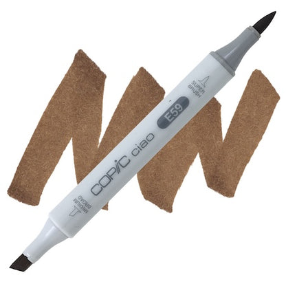 Copic Ciao marker in walnut color with a double-ended design, showing the tip of the marker on a brown background.