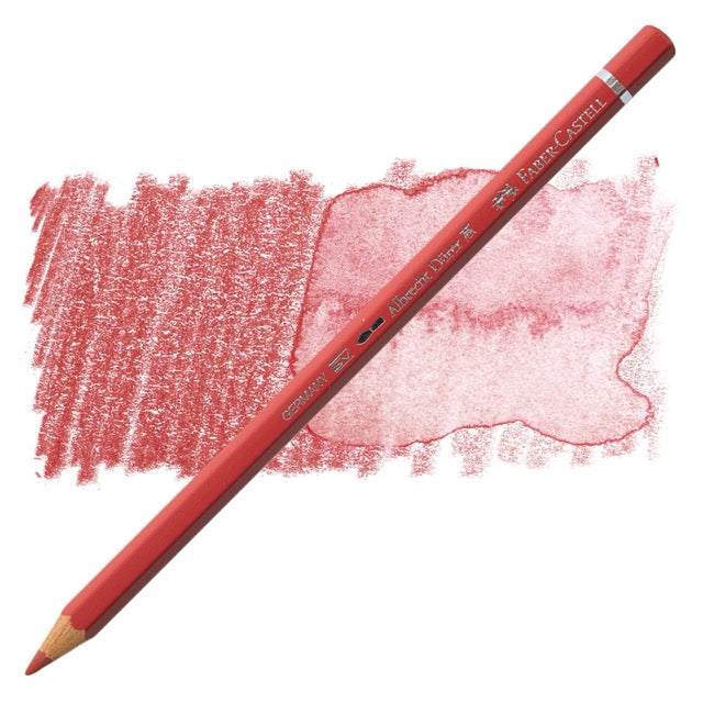 Red colored pencil with a sample of red color swatch on a white background