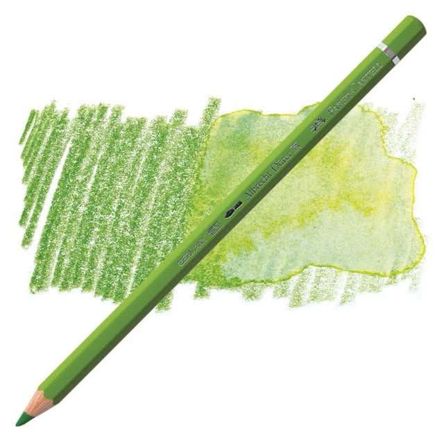 Green colored pencil with samples of green color on a white background