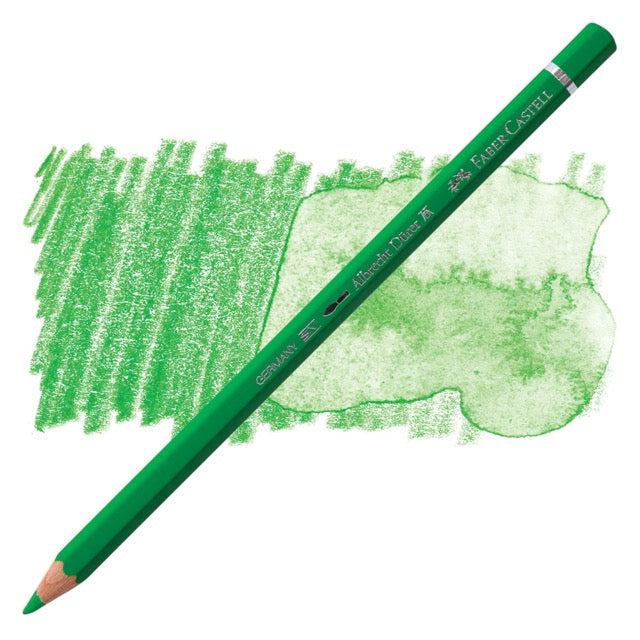 Green colored pencil with a sample of green color swatch on a white background
