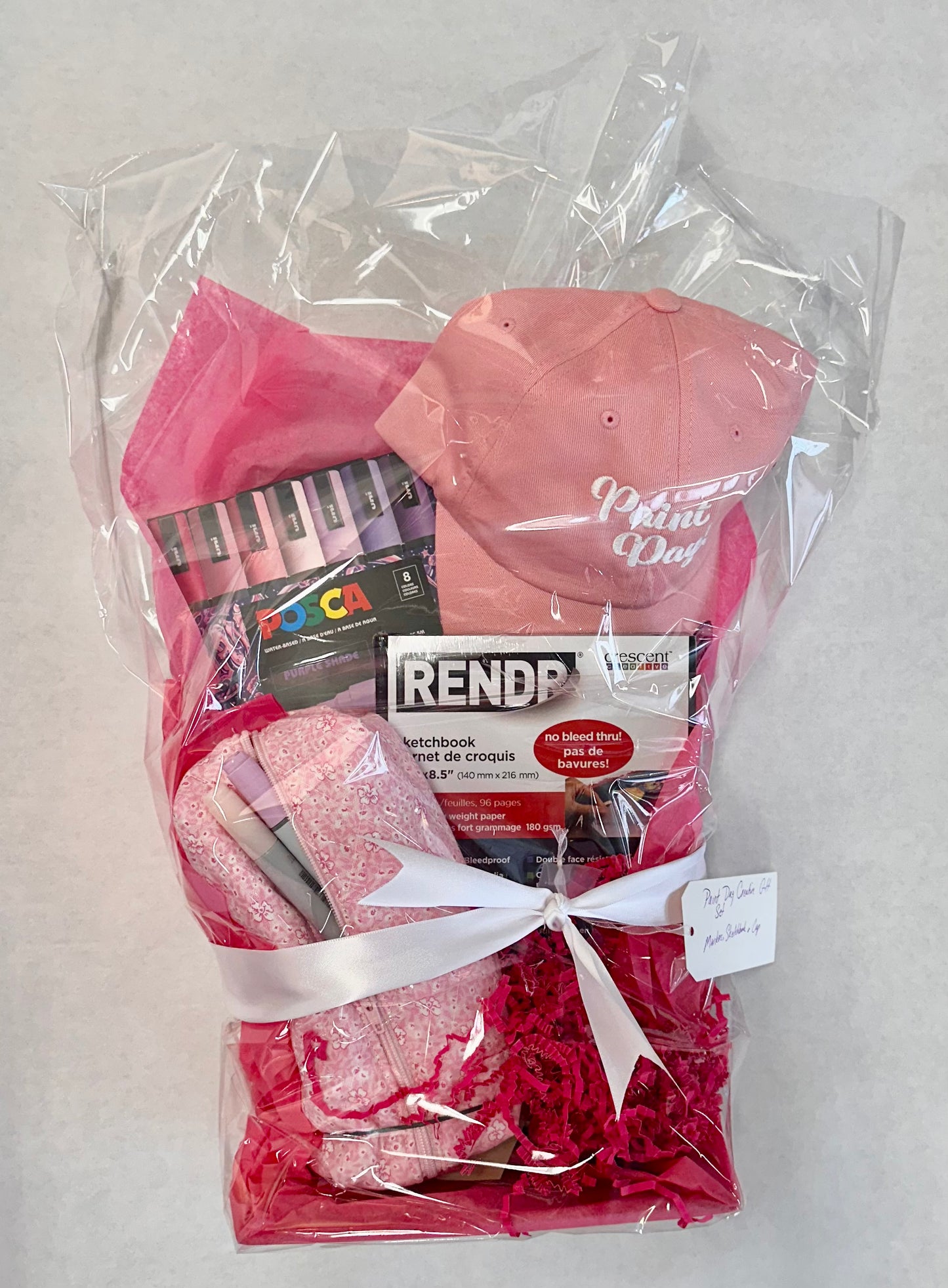 valentines theme gift of paint day cap, posca markers, pouch with extra markers.