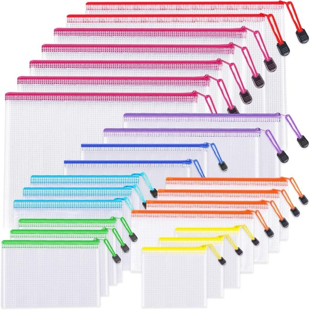 Set of clear ziplock bags with colorful zippers on a white background
