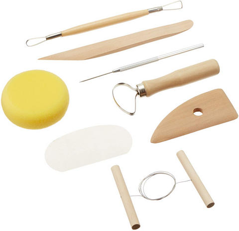 pottery tool kit on a white table