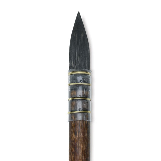 Black paintbrush with wooden handle on a white background