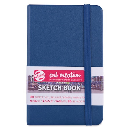 Blue sketchbook with 'Art Creation' label on a white background