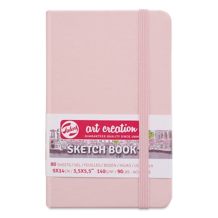 Pink sketchbook with 'Art Creation' branding on a white background