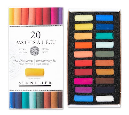 A collection of extra-soft pastel half sticks in various colors, presented in a cardboard set with the text 'Paris Collection' on the packaging.