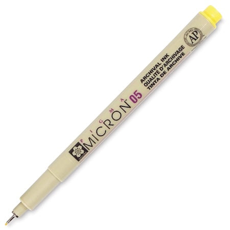 A Sakura Pigma Micron Pen with a yellow cap and a fine-point tip, labeled with the brand and model details.