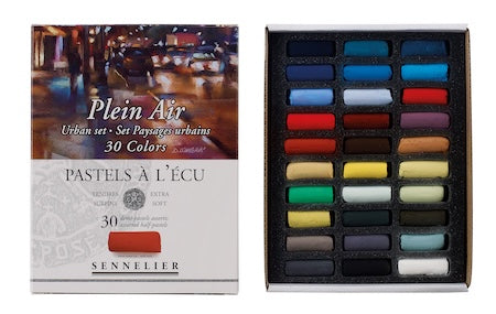 A collection of extra-soft pastel half sticks in various colors, presented in a cardboard set with the text 'Paris Collection' on the packaging.