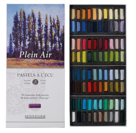 A collection of extra-soft pastel half sticks in various colors, presented in a cardboard set with the text 'Paris Collection' on the packaging.