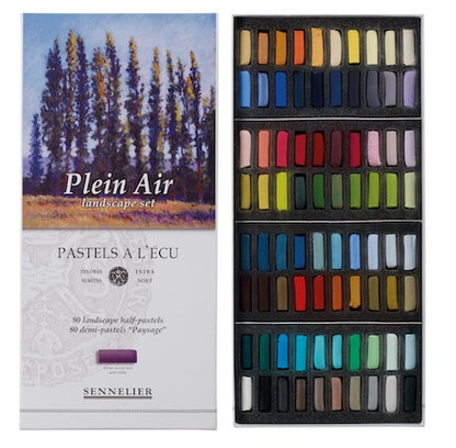 A collection of extra-soft pastel half sticks in various colors, presented in a cardboard set with the text 'Paris Collection' on the packaging.