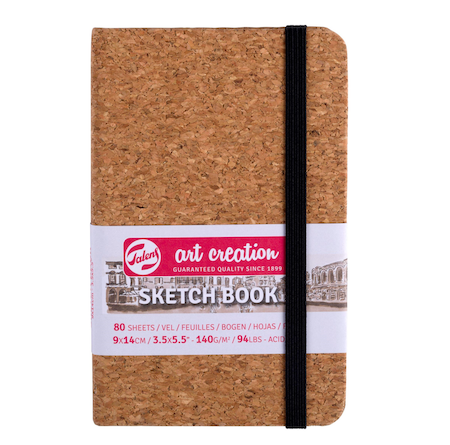 Cork notebook with a visible brand label on a white background