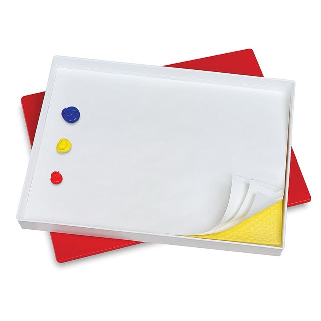 White board with colorful magnets on a white background