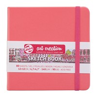 Pink sketchbook with a visible brand label on a white background