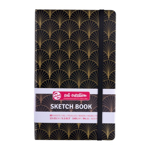 Sketchbook with black and gold pattern on a white background