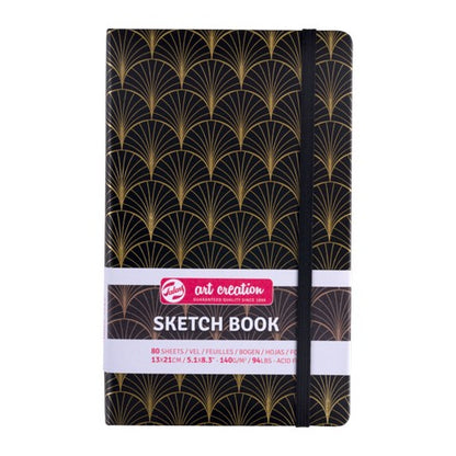 Sketchbook with black and gold pattern on a white background