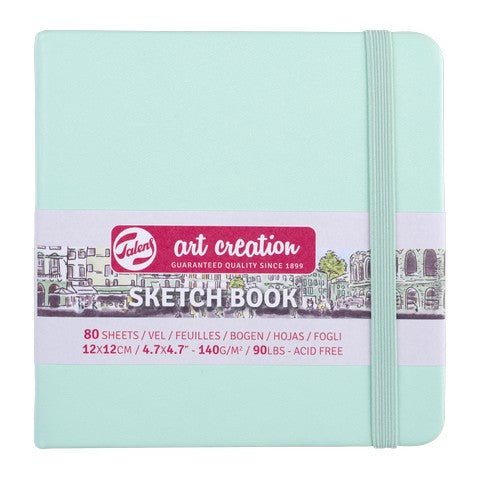 Sketchbook with a light blue cover and visible branding on a white background