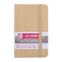 Sketchbook with kraft cover and white label on a white background