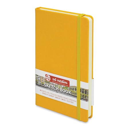 Yellow sketchbook with a visible brand label on a white background