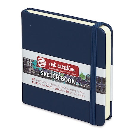 Navy blue sketchbook with a visible brand label on a white background