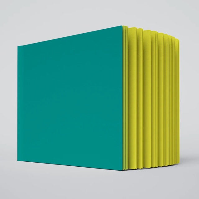 Teal and yellow notebook with a plain background