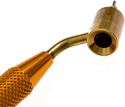 Gold-colored tool with a textured handle on a white background