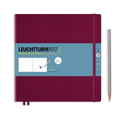Maroon notebook with blue label and white pencil on a white background